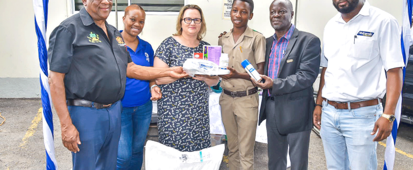 Minister of State in the Ministry of Agriculture and Fisheries, Hon. Franklin Witter (left); High Commissioner of Canada to Jamaica, Her Excellency Emina Tudakovic (third left); and Acting Chief Executive Officer of the Rural Agricultural Development Authority (RADA), Winston Simpson (second right), present supplies to 15-year-old small ruminant farmer and Oberlin High School student, Kaheim McLune (third right). The items, donated by Nutramix, were handed over to farmers participating in an ‘Internal and E