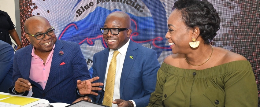 Tourism Minister, Hon. Edmund Bartlett (left), shares a good laugh with Agriculture and Fisheries Minister, Hon. Pearnel Charles Jr. and Member of Parliament for St. Andrew East Rural, the Most Hon. Juliet Holness, at the launch of the Jamaica Blue Mountain Coffee Festival, at Devon House, on January 9.