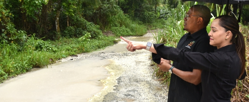 Minister of Agriculture, Fisheries, and Mining, Hon. Floyd Green (left) and Portland Eastern Member of Parliament, Ann-Marie Vaz, observe flood damage from heavy rainfall in sections of the constituency during a tour on January 3.