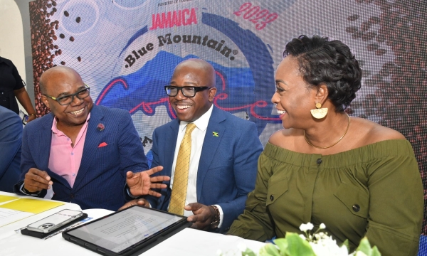 Tourism Minister, Hon. Edmund Bartlett (left), shares a good laugh with Agriculture and Fisheries Minister, Hon. Pearnel Charles Jr. and Member of Parliament for St. Andrew East Rural, the Most Hon. Juliet Holness, at the launch of the Jamaica Blue Mountain Coffee Festival, at Devon House, on January 9.