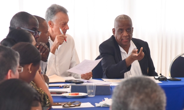Minister of State in the Ministry of Agriculture, Fisheries and Mining,  Hon. Franklin Witter (right), addresses a meeting of the Bauxite Subcommittee of the Manchester Parish Development Committee (MPDC) held on Friday (October 27), at the Tropics View Hotel in Mandeville. Seated next to the Minister is Chairman of the MPDC,  Anthony Freckleton.