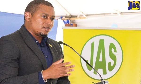 Minister of Agriculture, Fisheries and Mining, Hon. Floyd Green, addresses the launch of the Denbigh Agricultural, Industrial and Food Show today (June 21), at the Hi-Pro supercentre in St. Catherine.