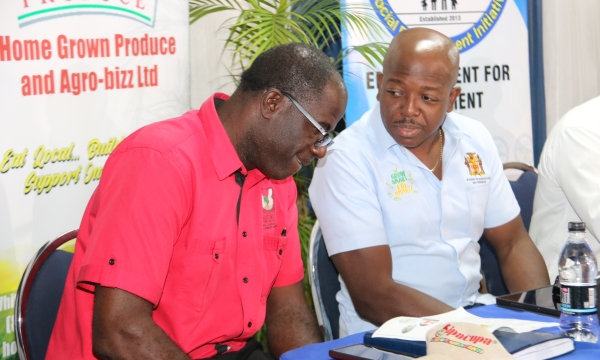 Manchester Parish Manager for the Rural Agricultural Development Authority (RADA), Winston Miller (left) and Minister of Agriculture and Fisheries, Hon. Pearnel Charles Jr, in a discussion at Home Grown Produce and Agri-Business Ltd’s Agri-Business Symposium held at Tropics View Hotel in Hatfield, Mandeville, on Thursday, January 19. 