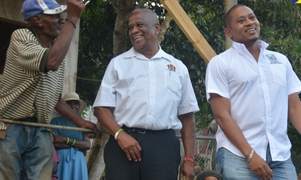 Minister of Agriculture, Fisheries and Mining, Hon. Floyd Green (right), and Minister of State in the Ministry of Agriculture, Fisheries and Mining, Hon. Franklin Witter (centre), interact with farmer Errol Reid during a visit to the Welcome Hall community in South St. James on Thursday, January 17.