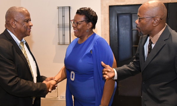 Minister of State in the Ministry of Agriculture, Fisheries and Mining, Hon. Franklin Witter (left) congratulates Director, Administration and Human Resources, National Irrigation Commission (NIC) Limited, Maxine Brown, on 35 years of sterling contribution to the agency. Looking on is Chief Executive Officer, Joseph Gyles. The event was the agency's 36th anniversary luncheon and long service awards ceremony on November 28 at the Jamaica Pegasus Hotel in New Kingston. 